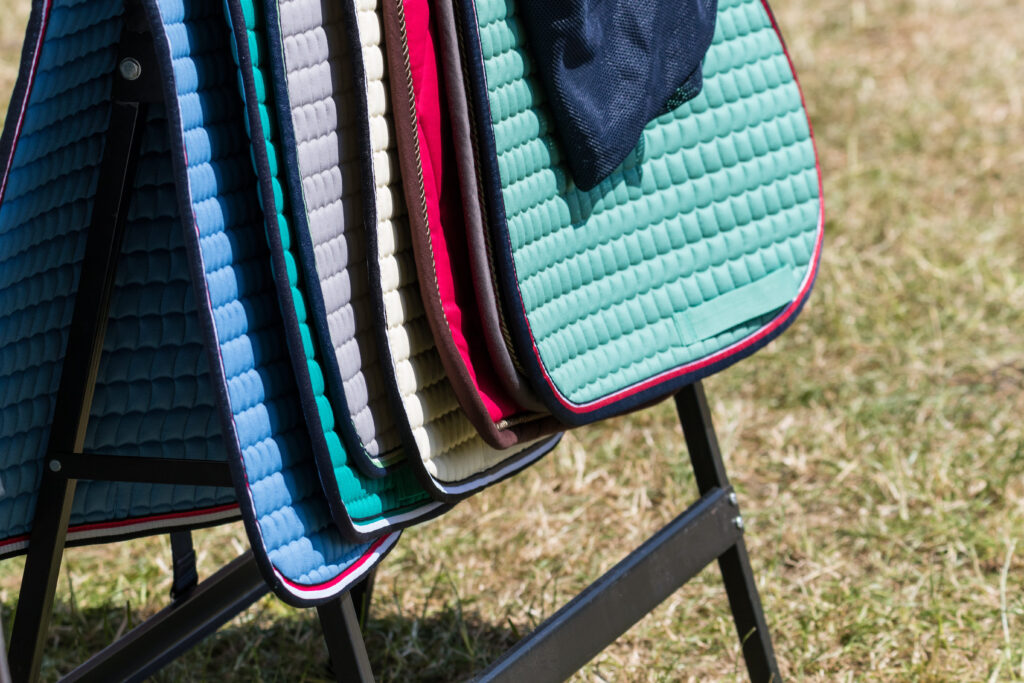 A stack of cute saddle pads